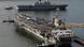 FILE - In this July 25, 2010 file photo, the Nimitz-class USS George Washington, bottom, and the South Korean navy's 14,000 ton-class large-deck landing ship Dokdo Ham, top, leave for the U.S.-South Korea joint military exercises at the Busan port in Busan, south of Seoul. On the heels of North Korea's attack on Yeonpyeong island that killed four people _ two of them civilians _ the Obama administration has sent the aircraft carrier to the Yellow Sea, between Korea and China, to take part in a previously planned joint exercise with South Korea starting Sunday, Nov. 28, 2010. (AP Photo/ Lee Jin-man, File) FILE - In this July 25, 2010 file photo, the Nimitz-class USS George Washington, bottom, and the South Korean navy's 14,000 ton-class large-deck landing ship Dokdo Ham, top, leave for the U.S.-South Korea joint military exercises at the Busan port in Busan, south of Seoul. On the heels of North Korea's attack on Yeonpyeong island that killed four people _ two of them civilians _ the Obama administration has sent the aircraft carrier to the Yellow Sea, between Korea and China, to take part in a previously planned joint exercise with South Korea starting Sunday, Nov. 28, 2010. (AP Photo/ Lee Jin-man, File)