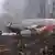 This image from Polish Television's TVP via APTN shows a firefighter walking near some of the wreckage at the crash site where Polish President Lech Kaczynski, his wife and some of the country's most prominent military and civilian leaders died Saturday April 10, 2010 along with dozens of others when the presidential plane crashed as it came in for a landing in thick fog in near Smolensk in western Russia. (ddp images/AP Photo/TVP via APTN)