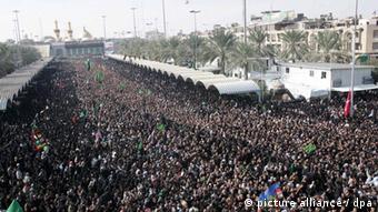 Shiite Muslims take part in a religious procession of Ashura near the holy shrine of Imam Husain in Karbala, southern Iraq, 27 December 2009. Muslims across the world are observing Muharram, the first month of Islamic calender, the climax of Muharram is the Ashura festival commemorating the martyrdom of Imam Hussein a grandson of the Prophet Mohammed in the Iraqi city of Karbala in the seventh century. EPA/ALAA AL-SHEMAREE
