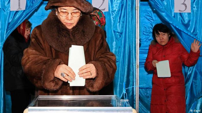 People vote at a polling station during the parliamentary elections