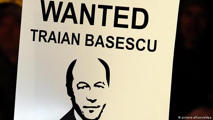 A poster referring to Romanian President Traian Basescu being wanted