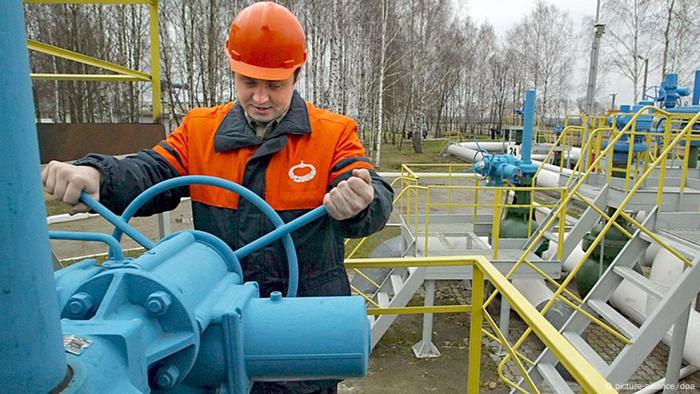 A worker turns a valve at the first pump station on Belarus territory of the Druzhba pipeline A worker turns a valve at the first pump station on Belarus territory of the Druzhba pipeline