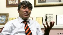 Hrant Dink seated in his office