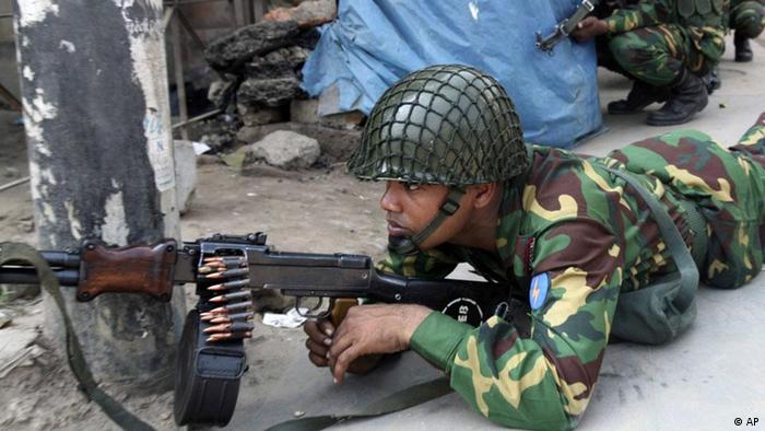 Bangladesh army troops take position outside the headquarters of Bangladesh Rifles in Dhaka in 2009