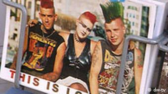 A postcard from London, with an image of three punk-rockers