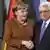 German Chancellor Angela Merkel, left, and the Palestinian Authority President Mahmoud Abbas