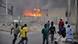 Smoke rises from the police headquarters as people run for safety in Nigeria's northern city of Kano January 20, 2012. At least six people were killed in a string of bomb blasts on Friday in Nigeria's second city Kano and the authorities imposed a curfew across the city, which has been plagued by an insurgency led by the Islamist sect Boko Haram. There was no immediate claim of responsibility for the apparently coordinated attacks. REUTERS/Stringer (NIGERIA - Tags: CRIME LAW CIVIL UNREST TPX IMAGES OF THE DAY)IL UNREST) Smoke rises from the police headquarters as people run for safety in Nigeria's northern city of Kano January 20, 2012. At least six people were killed in a string of bomb blasts on Friday in Nigeria's second city Kano and the authorities imposed a curfew across the city, which has been plagued by an insurgency led by the Islamist sect Boko Haram. There was no immediate claim of responsibility for the apparently coordinated attacks. REUTERS/Stringer (NIGERIA - Tags: CRIME LAW CIVIL UNREST TPX IMAGES OF THE DAY)IL UNREST)