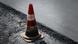 A traffic cone on a street A traffic cone on a street