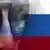 Человек в темных очках на фоне российского флага