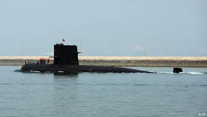 A Chinese navy submarine leaves Qingdao port on Wednesday April 22, 2009 in Qingdao, Shandong Province, China. China is marking 60 years of the Chinese navy and has invited ships and top officials from dozens of countries to attend. (ddp images/AP Photo/Guang Niu, Pool)