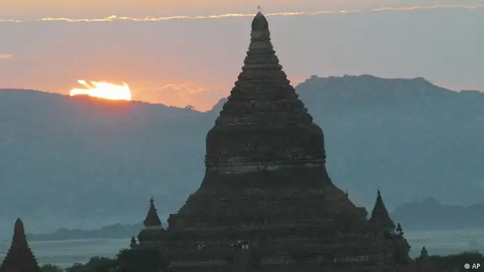 The sun sets past the Minglazedi temple on Tuesday, Nov. 11, 2003 in Bagan, the ancient capital of Myanmar. The temple, built in 1284, is one among more than 2,200 Buddhist temples and monuments dotting the plains of Bagan, one of the most popular tourist destinations of the country. (AP Photo/Vijay Joshi)
