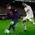 FC Barcelona's Lionel Messi, from Argentina, left, duels for the ball against Real Madrid's Cristiano Ronaldo, from Portugal, during their quarterfinal, second leg, Copa del Rey soccer match at the Camp Nou stadium, in Barcelona, Spain, Wednesday, Jan. 25, 2012. (Foto:Manu Fernandez/AP/dapd)