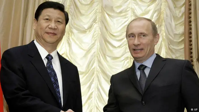 Russian Prime Minister Vladimir Putin, right, shakes hands with Chinese vice president Xi Jinping before their talks in Moscow, Russia, March 23, 2010.(AP Photo/Misha Japaridze)