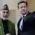 دیوید کامرون، نخست وزیر بریتانیا به همراه حامد کرزی رییس جمهور افغانستان در لندن