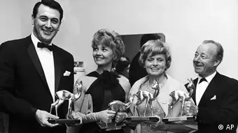 Holding their Bambi Film Awards on April 28, 1963 at the Schwarzwaldhalle (Black Forest Hall) in Karlsruhe, Germany are from left to right: US actor Rock Hudson, Swiss actress Liselotte Pulver, Austrian actress Luise Ullrich and German actor Heinz Ruehmann. (ddp images/AP Photo)