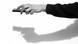 An arm using a remote control, casting the shadow of a hand holding a gun An arm using a remote control, casting the shadow of a hand holding a gun