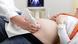 A woman undergoing an ultrasound A woman undergoing an ultrasound