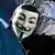 Anonymous_aktivist mit Guy-Fawkes-maske. Foto: dpa