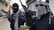 Syrian soldiers, who have defected to join the Free Syrian Army, hold up their rifles as they secure a street in Saqba, in Damascus suburbs, in this January 27, 2012 file photo. People have described Syrian President Bashar al-Assad to Reuters as a head of state fully abreast of events on the ground - not the mere puppet of hardliners that some have portrayed - "relaxed and phlegmatic", and determined to see off the challenge, offering some reforms, strictly on his own terms. While few rate his long-term prospects highly, all is not lost, at least for now. Assad's troops swiftly drove back the more lightly armed rebels from the outskirts of Damascus and many foresee a long struggle yet for a country, at the heart of the Middle East, that is trapped in a "balance of weakness". Picture taken January 27, 2012. To match Insight SYRIA/ASSAD REUTERS/Ahmed Jadallah/Files (SYRIA - Tags: CIVIL UNREST POLITICS MILITARY) Syrian soldiers, who have defected to join the Free Syrian Army, hold up their rifles as they secure a street in Saqba, in Damascus suburbs, in this January 27, 2012 file photo. People have described Syrian President Bashar al-Assad to Reuters as a head of state fully abreast of events on the ground - not the mere puppet of hardliners that some have portrayed - "relaxed and phlegmatic", and determined to see off the challenge, offering some reforms, strictly on his own terms. While few rate his long-term prospects highly, all is not lost, at least for now. Assad's troops swiftly drove back the more lightly armed rebels from the outskirts of Damascus and many foresee a long struggle yet for a country, at the heart of the Middle East, that is trapped in a "balance of weakness". Picture taken January 27, 2012. To match Insight SYRIA/ASSAD REUTERS/Ahmed Jadallah/Files (SYRIA - Tags: CIVIL UNREST POLITICS MILITARY)