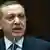 Turkey's Prime Minister Recep Tayyip Erdogan at pult addressing lawmakers in Ankara