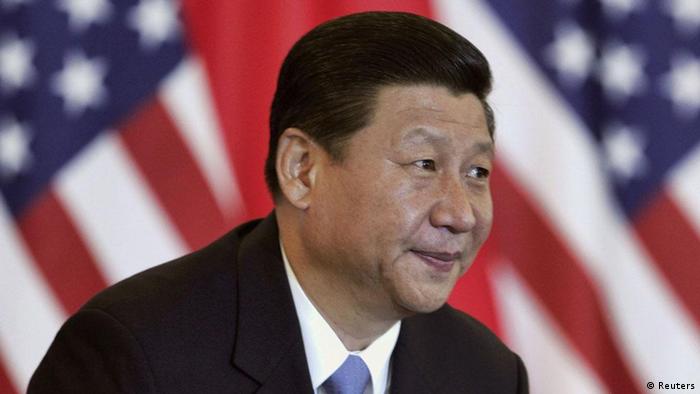 China's Vice President Xi Jinping smiles during a discussion with U.S. and Chinese business leaders at Beijing Hotel in Beijing, in this August 19, 2011 file photograph. A Communist princeling fond of small town America and Hollywood war dramas, and brusque critic of Western pressure with a daughter at Harvard, Chinese leader-in-waiting Xi Jinping embodies his nation's contradictory ties with the United States. Xi's visit to the United States next week will enhance his aura of readiness to lead China from late this year. It could also set the mood for the next decade that he is likely to serve as president, an era when Sino-U.S. relations face deep and potentially troublesome shifts. REUTERS/Lintao Zhang/Pool/Files (CHINA - Tags: POLITICS BUSINESS HEADSHOT)