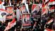 Egyptians hold posters supporting Omar Suleiman Egyptians hold posters supporting Omar Suleiman