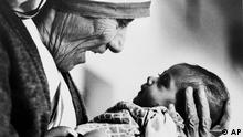 Mother Teresa, head of the Missionaries of Charity order, cradles an armless baby girl at her order's orphanage in Calcutta, India in 1978. A champion among the poor in India, Mother Teresa received the Nobel Peace Prize Oct. 17, 1979. An Albanian, she went to India in 1928 to teach at a convent school, taking her final vows as a Roman Catholic nun in 1937, and opened her House for the Dying in 1952. Mother Teresa's devotion to the destitute children of Calcutta, lepers and other unfortunates of theworld set a new standard of compassion for humanity. She died Sept. 5, 1997, at the age of 87. (AP Photo/Eddie Adams)