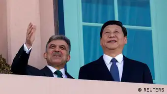 China's Vice President Xi Jinping (R) and Turkey's President Abdullah Gul stand at a balcony at the Presidential Palace in Ankara February 21, 2012. China's leader-in-waiting Xi visits Turkey on Tuesday, his last stop on a trip that has taken him to the United States and Ireland, a recognition of Ankara's growing global economic and diplomatic clout. REUTERS/Umit Bektas (TURKEY - Tags: POLITICS)