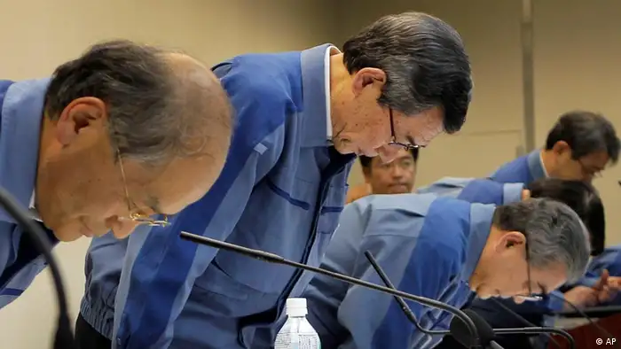 Tokyo Electric Power Co. (TEPCO) President Masataka Shimizu, center, TEPCO executive Toshio Nishizawa, right, and Vice President Masaru Takei bow during a news conference on its fiscal 2010 earning at the company's head office in Tokyo Friday, May 20, 2011. Shimizu said Friday he was stepping down in disgrace after reporting the biggest losses in company history. (AP Photo/Itsuo Inouye)