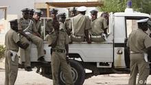 Police seen as they provide security at a voting station in the city of Nouakchott, Mauritania, Sunday, June 25, 2006. Junta-led Mauritania held an extraordinary referendum Sunday giving voters their first-ever chance to place limits on presidential terms through amendments that would enshrine the principal of democratic regime change in the desert nation's constitution. (ddp images/AP Photo/ Schalk van Zuydam)
