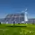 Солнечные батареи и ветрогенератор на зеленой лужайке
