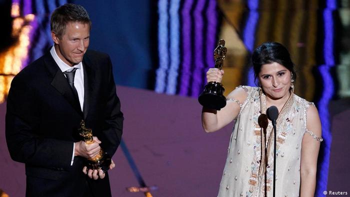 Daniel Junge and Sharmeen Obaid-Chinoy accept the Oscar for the Best Documentary Short Subject for their film Saving Face at the 84th Academy Awards in Hollywood, California, February 26, 2012 (Photo: REUTERS/Gary Hershorn)