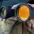 A person looking out of binoculars Photo: picture-alliance/dpa