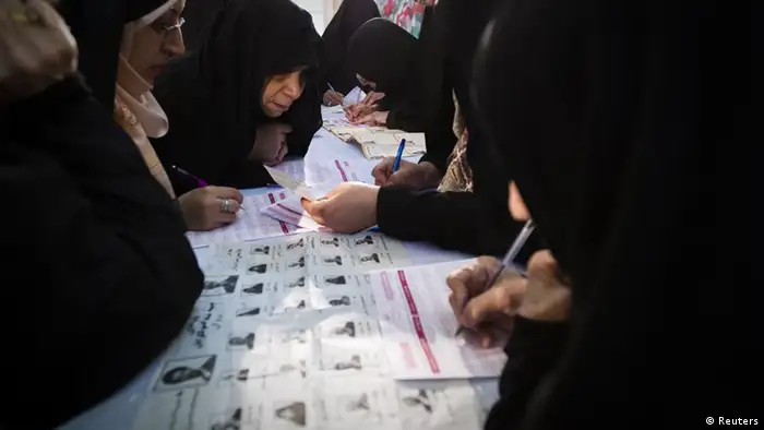 EDITORS' NOTE: Reuters and other foreign media are subject to Iranian restrictions on leaving the office to report, film or take pictures in Tehran. Women fill up their ballot papers during the parliamentary election at a mosque in southern Tehran March 2, 2012. Iranians voted on Friday in a parliamentary election which is expected to reinforce the power of the clerical establishment of Supreme Leader Ayatollah Ali Khamenei over hardline political rivals led by President Mahmoud Ahmadinejad. REUTERS/Raheb Homavandi (IRAN - Tags: POLITICS ELECTIONS TPX IMAGES OF THE DAY)