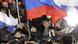 People take part in a rally in support of Russia's current Prime Minister and presidential candidate Vladimir Putin in Manezhnaya Square near the Kremlin in central Moscow March 4, 2012. Vladimir Putin won a resounding victory in Russia's presidential election on Sunday, exit polls showed, securing a new six-year term in the Kremlin and a mandate to deal with opposition protests after a vote that opponents said was marred by fraud. REUTERS/Denis Sinyakov (RUSSIA - Tags: POLITICS ELECTIONS) People take part in a rally in support of Russia's current Prime Minister and presidential candidate Vladimir Putin in Manezhnaya Square near the Kremlin in central Moscow March 4, 2012. Vladimir Putin won a resounding victory in Russia's presidential election on Sunday, exit polls showed, securing a new six-year term in the Kremlin and a mandate to deal with opposition protests after a vote that opponents said was marred by fraud. REUTERS/Denis Sinyakov (RUSSIA - Tags: POLITICS ELECTIONS)