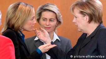 Angela Merkel, right, with Ursula von der Leyen, center, and Christina Schröder.