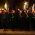 "вечірня зоря" (Großen Zapfenstreich) – освітлений вогнями смолоскипів військовий парад у парку палацу Бельвю
