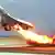 Air France Concorde flight 4590 takes off with fire trailing from its engine on the left wing from Charles de Gaulle airport in Paris, in this July 25, 2000 file photo. (Photo by Toshihiko Sato, via AP)