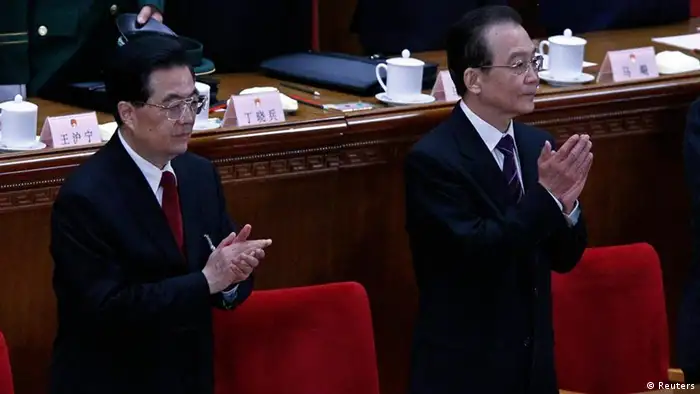 China's Premier Wen Jiabao (R) and President Hu Jintao (L) claps at the end of the closing ceremony of the National People's Congress (NPC) at the Great Hall of the People in Beijing, March 14, 2012. REUTERS/David Gray (CHINA - Tags: POLITICS)