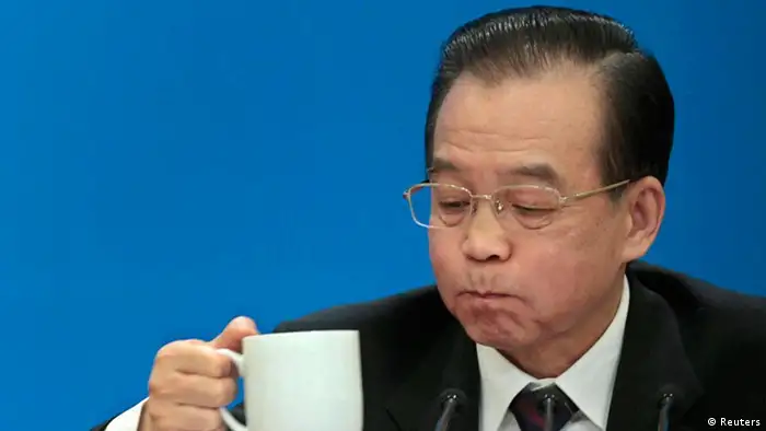 China's Premier Wen Jiabao drinks tea as he takes a break during a news conference after the closing ceremony of the National People's Congress (NPC) at the Great Hall of the People in Beijing, March 14, 2012. REUTERS/Jason Lee (CHINA - Tags: POLITICS TPX IMAGES OF THE DAY)