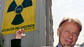 Then Environment Minister Juergen Trittin unveils a nuclear power: off poster on the ministry's wall in 2005