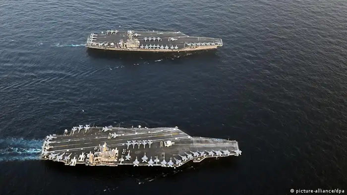 The handout of the US Navy shows the Nimitz-class aircraft carriers USS Abraham Lincoln (CVN 72, front) and USS John C. Stennis (CV 74) join for a turnover of responsibility in the Arabian Sea, 19 January 2012. Both ships are deployed to the U.S. 5th Fleet area of responsibility. Photo Eric S. Powell / US Navy photo / Editotial use only +++(c) dpa - Bildfunk+++