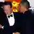U.S. President Barack Obama and British Prime Minister David Cameron embrace after a toast during the State Dinner at the White House in Washington March 14, 2012. REUTERS/Kevin Lamarque (UNITED STATES - Tags: POLITICS)