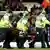 Fabrice Muamba is taken from the pitch