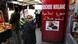 In this photo taken Friday, March 9, 2012, a shopper walks past a butcher shop at a market in Paris. President Nicolas Sarkozy has lamented the decline of the traditional French butcher and now wants all meat clearly marked halal, kosher or French while Prime Minister Francois Fillon has suggested that the ritual slaughter of animals by Muslims and Jews is out of sync with modern times. With polls showing Sarkozy will lose to Socialist rival Francois Hollande in the upcoming presidential election, the president is racing after third-place extreme-right candidate Marine Le Pen's voters. (Foto:Michel Euler/AP/dapd) In this photo taken Friday, March 9, 2012, a shopper walks past a butcher shop at a market in Paris. President Nicolas Sarkozy has lamented the decline of the traditional French butcher and now wants all meat clearly marked halal, kosher or French while Prime Minister Francois Fillon has suggested that the ritual slaughter of animals by Muslims and Jews is out of sync with modern times. With polls showing Sarkozy will lose to Socialist rival Francois Hollande in the upcoming presidential election, the president is racing after third-place extreme-right candidate Marine Le Pen's voters. (Foto:Michel Euler/AP/dapd)