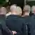 Men with shaved heads attend a Neo-Nazi concert
