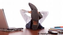 businessman relaxing at the office with his shoes on the desk (isolated on white). Fotolia_17714627_Subscription_XXL.jpg