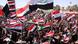 People chant anti-Iraqi Government slogans and wave Iraqi flags during a protest in Basra, Iraq's second-largest city, 550 kilometers (340 miles) southeast of Baghdad, Iraq, Monday, March 19, 2012. Followers of the anti-American Shiite cleric Muqtada al-Sadr are demanding better living conditions in Iraq on the ninth anniversary of the U.S.-led invasion of their country . (Foto:Nabil al-Jurani/AP/dapd) People chant anti-Iraqi Government slogans and wave Iraqi flags during a protest in Basra, Iraq's second-largest city, 550 kilometers (340 miles) southeast of Baghdad, Iraq, Monday, March 19, 2012. Followers of the anti-American Shiite cleric Muqtada al-Sadr are demanding better living conditions in Iraq on the ninth anniversary of the U.S.-led invasion of their country . (Foto:Nabil al-Jurani/AP/dapd)
