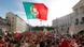 Demonstrators wave a Portuguese flag outside parliament Demonstrators wave a Portuguese flag outside parliament