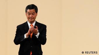 The next Hong Kong Chief Executive Leung Chun-ying celebrates after winning the chief executive election, at a vote counting station in Hong Kong March 25, 2012. An election committee of 1,200 Hong Kong notables picked Beijing-loyalist Leung as the city's next leader on Sunday following an election campaign marred by scandals and a tide of public discontent at a high degree of perceived interference from Beijing over the small circle poll. REUTERS/Tyrone Siu (CHINA - Tags: POLITICS CIVIL UNREST ELECTIONS)